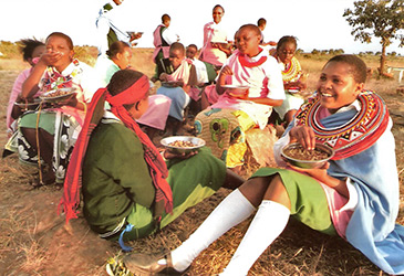 Suguta Marmar girls eating a healthy meal.